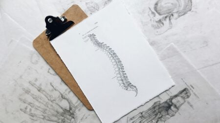 How can you reduce work-related back pain problems?
