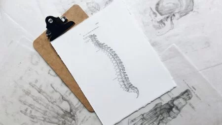 How can you reduce work-related back pain problems?